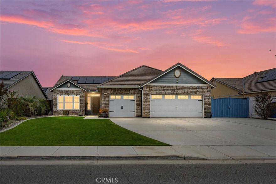 Welcome to this beautifully maintained home offering exceptional curb appeal, gated RV parking, and an expansive 3-car garage. Move-in ready, it features a neutral color palette and large tile in high-traffic areas for practicality. At the front of the home, a spacious flex room offers versatile use—ideal for a home office or additional living area. The kitchen features granite countertops and bar-top seating flowing seamlessly into the adjacent great room for comfortable gatherings or relaxing at home. The private primary suite provides a soaking tub, walk-in shower, dual sinks, and generous storage. Step outside to a covered patio and dual ceiling fans, a perfect setting for outdoor dining, while the thoughtfully landscaped lawn, rock-lined borders, and retaining wall add beauty and function. The finished garage has the added perk of a dedicated water-pressure system connected to a 100-ft hose on a reel—ideal for washing cars, garage door, or driveway & side yard.