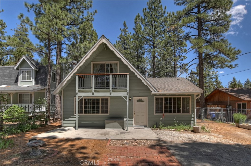 Charming 3-bedroom, 1-bath chalet nestled in the desirable Peter Pan neighborhood of Big Bear City. This well-maintained mountain retreat features beautiful, beamed tongue-and-groove ceilings and an open-concept layout, perfect for cozy living or entertaining. Enjoy the warmth of a classic brick fireplace and the convenience of forced air heating. The main level offers a bedroom and full bath, along with a separate laundry/pantry room for added functionality. Outdoors, the property boasts two decades of lovingly tended sustainable landscaping, crafted by a seasoned gardener. A true mountain gem with rustic charm and modern updates—ideal for full-time living or a weekend getaway.