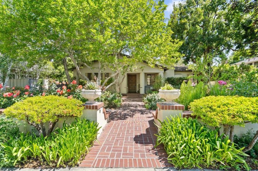 Beautiful home in Old Palo Alto plus guest house and an additional detached unit on 13,000 sqft lot. This estate offers exceptional privacy & seamless indoor/outdoor living. Approach the gracious portico entry via an elegant herringbone brick path through meticulous gardens w/ lush perennials. living rm w/fireplace and a formal dining rm, each w/ hardwood floors, and French doors opening to the grounds. Expansive kitchen w/ample cabinet space & work nook flows to an inviting family rm with add fireplace & sun-drenched breakfast nook with banquette seating; both opening to the garden patio. Laundry rm contains stairs to basement. 3 bdrms including primary suite on the main level w/ oversized walk in closet. 2 bdrm &1 bth on the 2nd floor.  Entertainer's dream grounds w/ vast al fresco dining under mature trees and a pergola, accented by a custom brick-bordered fountain with calla lilies. Two detached structures offer exceptional flexibility: (1) a charming guest house with one bedroom, one bathroom, living space, & kitchenette, & (2) an additional unit with a kitchenette, perfect for a fitness center, game rm/ artist's studio, vaulted ceilings, dramatic skylights & expansive windows. Premier address on a tranquil, tree-lined street in one of Palo Altos most coveted locations.
