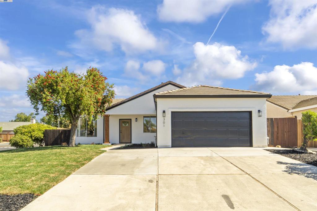 Welcome to 301 Lakespring Pl – A Turnkey Beauty in the Heart of Oakley! Located in the highly sought-after Vintage Parkway community, this stunning single-story home has been remodeled from top to bottom and is truly move-in ready. Nestled on a spacious 6,200 sq ft premium corner lot, this 3-bedroom, 2-bathroom gem offers 1,320 sq ft of beautifully designed living space. Step inside to discover an inviting open-concept layout with seamless flow between the living, dining, and kitchen areas—perfect for both everyday living and entertaining. The luxurious kitchen features quartz countertops, gorgeous cabinetry, and modern appliances that blend style and function effortlessly. The large primary suite is your personal retreat, complete with a phenomenal en-suite bathroom offering generous space and comfort. Every inch of this home has been thoughtfully upgraded, from the fresh interior and exterior paint to the newly landscaped yards, ensuring a fresh, clean look inside and out. Located within walking distance to schools, parks, shopping, and dining, this home offers convenience, charm, and high-end finishes in a fantastic neighborhood. Don't miss this rare opportunity to experience the best of Oakley living!