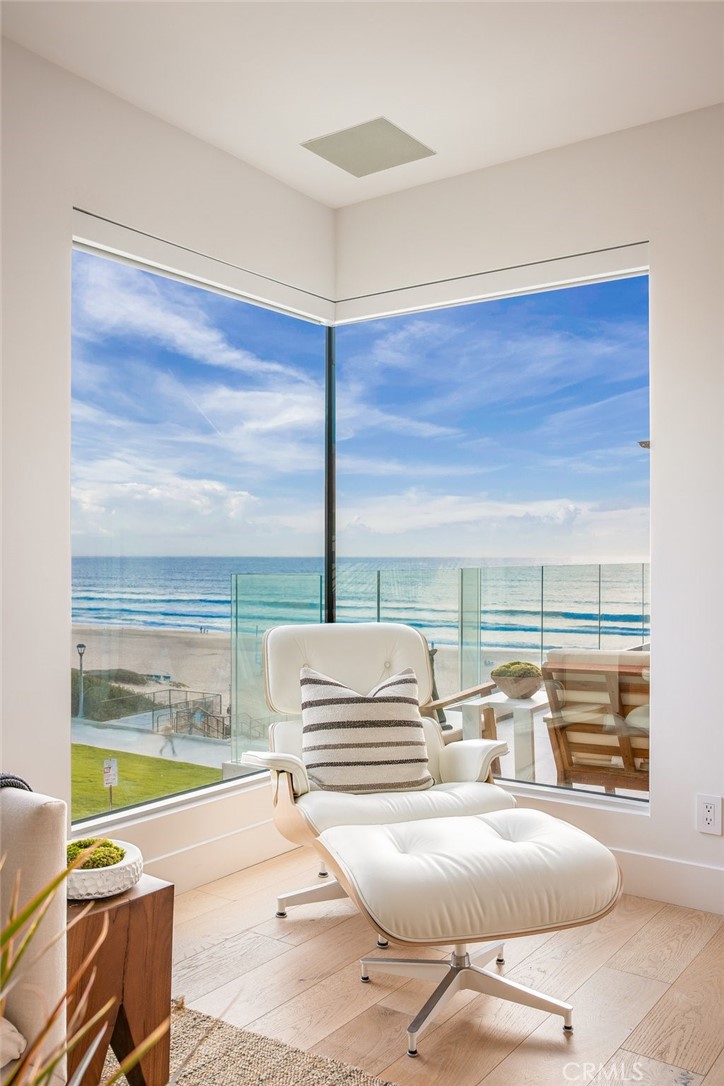 Rare Opportunity on The Strand.
With fewer than 50 condos or townhomes ever sold on The Strand, this southwest-facing corner townhome offers what's nearly impossible to find in Manhattan Beach—unobstructed ocean views and exceptional privacy.
Located adjacent to Bruce's Beach and the lifeguard station, this 1,900 square foot residence features panoramic views from Catalina Island to Palos Verdes and the Manhattan Beach Pier. The home was completely remodeled in 2021 and is fully integrated with Smart Home technology.
Primary Suite: Designer lighting, custom built-ins, motorized blackout and soundproofing drapes, and French doors to a private patio with ocean views. The spa-like bathroom includes a soaking tub, walk-in shower, dual vanities, custom walk-in closet, underfloor heating, and a Toto Neorest toilet with advanced functionality.
Secondary Bedroom: Bright and airy with coastline views and its own en-suite bathroom, offering both privacy and comfort.
Ground-Level Bedroom/Flex Space: Currently staged as a private fitness area with a Tonal system, elliptical, and a high-end custom Murphy bunk bed for guests. Includes an en-suite ¾ bath and access to a private patio.
Main Living Area: The reverse floor plan positions the main living areas on the top floor to maximize views. The recently remodeled kitchen features custom cabinetry, floating shelves, Sub-Zero refrigerator, wine fridge, and JennAir gas range with ocean views from the sink. Expansive sliding glass doors bathe the space in natural light.
Entertainment Deck: Features a built-in gas BBQ, Green Egg smoker, outdoor refrigerator, and brand-new motorized awning—perfect for hosting or enjoying Manhattan Beach's spectacular views.
Just steps from the sand and a short walk to downtown Manhattan Beach, 2702 The Strand offers an ideal blend of privacy, convenience, and beachfront living. Home can be purchased fully furnished.