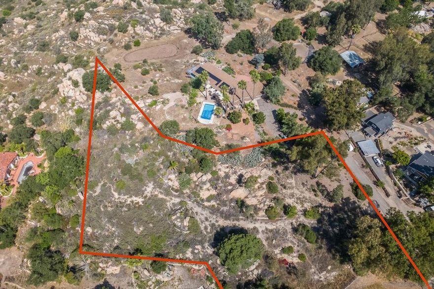 Welcome to your blank canvas in the heart of Fallbrook with off of Freeway 15! This 1.75-acre parcel of vacant land is nestled among million-dollar estates and offers the perfect blend of privacy, natural beauty, and development potential. Surrounded by serene landscapes and breathtaking panoramic views, this elevated lot captures sweeping views of Vista, Pala Mesa, Monserate Mountain, Bonsall, and stretches all the way to the Ocean. Wake up to golden sunrises and unwind with vibrant sunsets over the peaceful valley below. With city water already connected and power lines running along the property. Whether you envision a luxury estate, modern farmhouse, or peaceful retreat, this spacious and tranquil setting offers possibilities to design your forever home. Don’t miss this rare opportunity to own a piece of Fallbrook paradise—where privacy, views, and potential come together in one extraordinary location. The seller is willing to contribute half the cost of a DEHQ feasibility approval for a septic system.