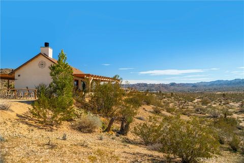 Photo of 5517 Bartlett Mountain Road, Joshua Tree, CA 92252 (MLS # JT26037997)