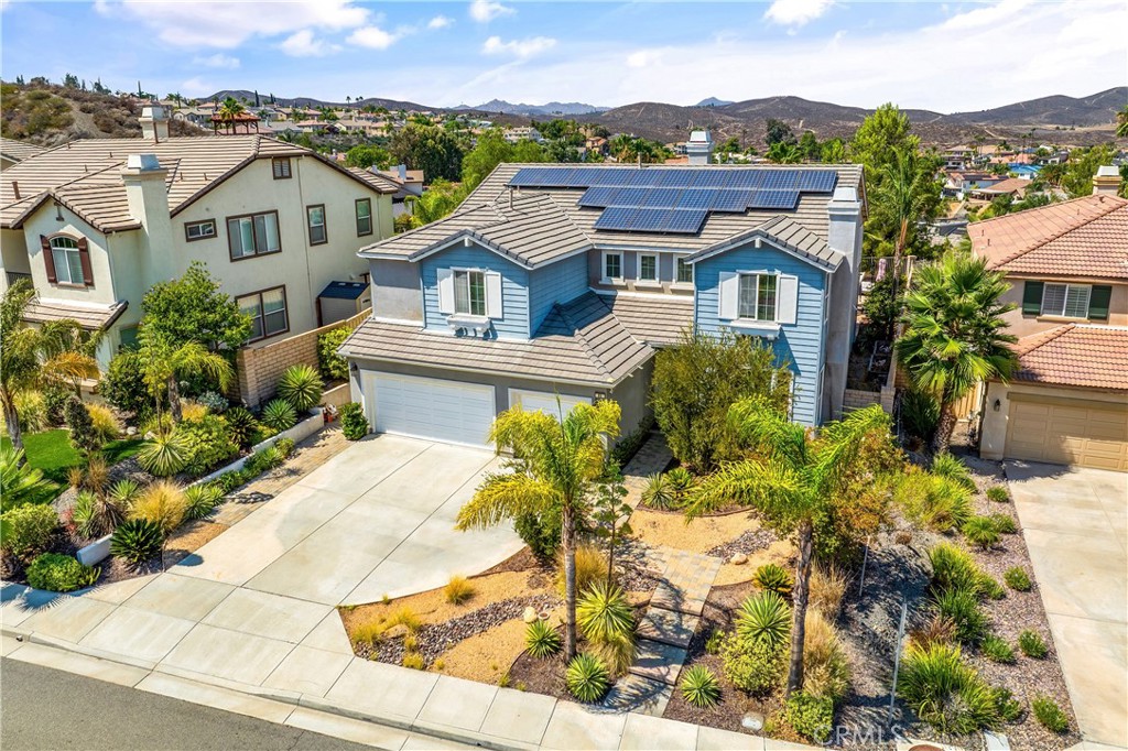 Stunning Pool Home with Paid Solar in Sought-After Watermark Community at Tuscany Hills!
Welcome to this beautifully upgraded home nestled in a quiet cul-de-sac within the prestigious Watermark community of Tuscany Hills. This residence offers the perfect blend of luxury, functionality, and resort-style living.
As you enter, you’re greeted by an elegant formal living and dining area on the right, ideal for entertaining. To the left, a spacious private suite on the main level features upgraded wood flooring, its own exterior access to the backyard, and is perfect for guests or multi-generational living.
The chef’s kitchen is a true showstopper—complete with a large center island with bar seating, granite countertops and backsplash, double ovens, stainless steel appliances, abundant cabinetry, and a convenient butler’s pantry connecting to the formal dining room. Just off the kitchen, a secondary living space offers direct access to your own backyard oasis.
Step outside to enjoy the breathtaking backyard, designed for relaxation and entertainment. It features a custom saltwater pool and spa, a cozy fire pit, paver decking, and a covered patio—perfect for outdoor gatherings.
Upstairs, you’ll find four additional bedrooms. Two share a Jack-and-Jill bathroom, one enjoys its own private ensuite, and the expansive primary suite is a retreat of its own. The primary bath boasts a jetted tub, custom shower, dual vanities with a dedicated makeup area, and a generous walk-in closet. Step onto the private balcony to enjoy serene views of Canyon Lake—an ideal spot for morning coffee or sunset unwinding.
Additional highlights include two separate loft areas—perfect for a home theater setup (projector screen included), cathedral ceilings, a tankless water heater, dual-zone A/C, and fully paid solar panels.
Residents of Tuscany Hills enjoy top-tier amenities including a community pool and spa, tennis courts, playground, picnic areas, and a clubhouse.
Don’t miss your chance to own this exceptional home in one of Lake Elsinore’s most desirable neighborhoods—schedule your private tour today!