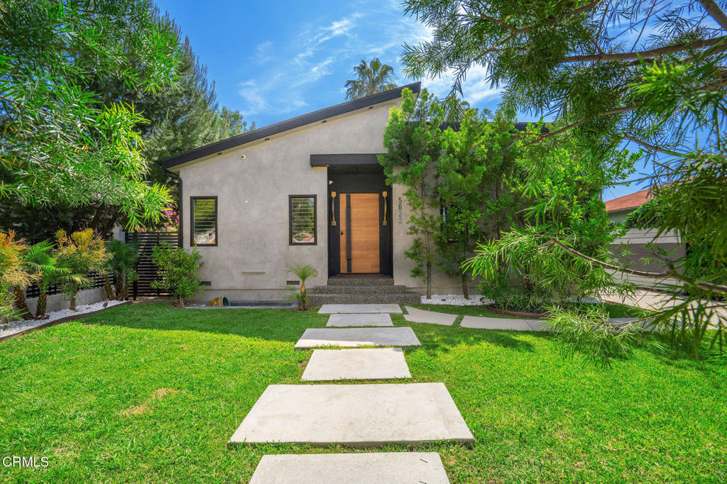 Discover modern elegance in this recently renovated home that features 5 bedrooms and 6 bathrooms. This quintessential residence was designed with sophistication and impeccable taste, boasting an open floor plan and soaring 10' ceilings that invite an abundance of natural light. The heart of the home is the gourmet chef kitchen, featuring a 12' central island with a 6' breakfast bar, pot filler, and quartz countertops, ideal for culinary enthusiasts. Adjacent to the immaculate kitchen is the gorgeous dining area with a signature chandelier and a gorgeous wine rack, creating the perfect entertainer's space or just a night to unwind. The inviting living room is adorned with a captivating modern fireplace, making it such a warm and enjoyable room to relax. Quintessential California indoor-outdoor living at its best - Seamlessly transition between the living room and the outdoor through the 12' sliding pocket doors, opening to a serene backyard with a sparking pool and fountain, cabana, and built-in BBQ. The private backyard is a nature hideaway from the hustle and bustle. The spacious primary suite offers a direct access to the pool, creating a personal oasis. The exquisitely renovated and oversized en-suite bathroom is complete with double sinks, enclosed water closet and shower. Each bedroom is a private sanctuary, complete with its own en-suite bathroom adorned with designer marble tiles, custom cabinetry, and frameless shower doors. Solar panels on roof ready to save electricity cost; ev charger outlet ready for your ev's. The home is centrally located to the Westside, Santa Monica, Ventura Blvd's amazing eateries, shops, cafes and lounges, DTLA, Studio City, Costco, Trader Joe's and Starbucks. Come see your future home - the perfect blend of luxury and convenience.