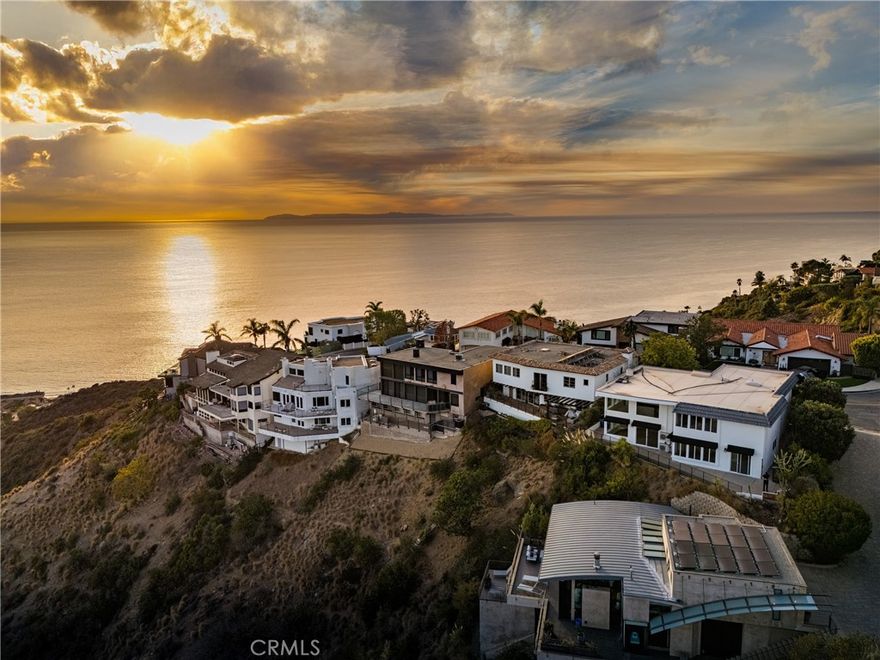 Spectacular panoramic, unobstructed white water and coastline views are simply inspiring from this dramatic completely renovated contemporary home with open floor plan, towering 20 foot ceilings and walls of glass. Terrazzo stone and newer floors, quartz countertops and massive stone fireplace. A gourmet kitchen with stainless appliances, breakfast nook, formal dining and Great room with soaring two story ceiling frames the amazing views of the Pacific. A curved staircase leads to 3 spacious bedrooms including primary with large walk-in closet and jaw-dropping views. A large den on the main floor can be converted to be a fourth bedroom. Private, gated courtyard with sparkling pool and view terrace with built-in BBQ creates the ultimate outdoor living. Easy access to world class beaches, restaurants, and shopping.