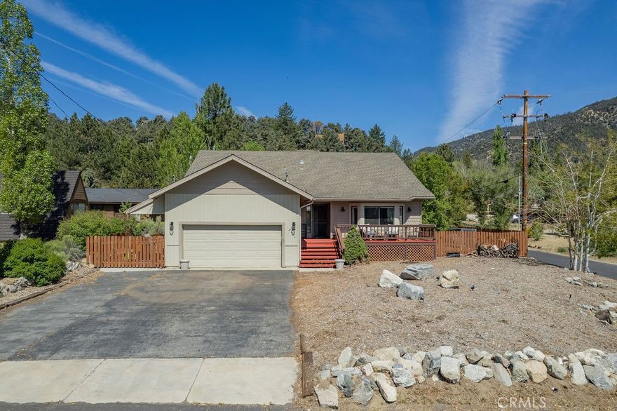 Welcome to this stunning single-level home, a rare gem spanning 2,336 square feet, located on a corner flat lot in the picturesque Pine Mountain Club. This property boasts beautiful mountain views and is conveniently close to the village with cafe’s, a general store, and local shops. Also close by are the local amenities, including parks, basketball courts, tennis courts, a baseball field, a clubhouse, a recreation room, a golf course, an equestrian center, a scenic lake with catch-and-release fishing, and an Olympic-style pool with a hot tub.

As you enter through the front door, you are welcomed into the bright living room, featuring vaulted ceilings, a cozy pellet stove, and ample windows, including a charming bay window that invites natural light. The kitchen is a chef's dream, equipped with stainless steel appliances, abundant counter and cabinet space, and it seamlessly flows into the family room. The family room features French doors that lead to the back deck, perfect for entertaining or enjoying the serene outdoors.

This home offers three spacious bedrooms, including a luxurious primary suite that features three closets, vaulted ceilings, and skylights, bathing the room in natural light. The primary bathroom is a true retreat, complete with a jet tub, separate walk-in shower, an expansive vanity, large wooden ceiling beams, and an extra room that can serve as an office or gym, also with French doors to the back deck. The home includes two full bathrooms, ensuring ample convenience for family and guests.

Additional features include a whole house generator for peace of mind, a whole house fan for comfort, central heating, and ceiling fans throughout. Fresh interior paint, hard flooring throughout (carpet in the bedrooms), and built-in cabinets in the dining room and hallway add to the home’s charm. The paved, flat driveway is a rarity, making it easy for shoveling snow during winter months, and a laundry room with garage access adds practical convenience.

Step outside to enjoy a fully fenced backyard (also a rarity) and the front porch deck—ideal spots for relaxation and enjoyment of the beautiful surroundings. Don't miss the opportunity to make this exquisite property your dream home!