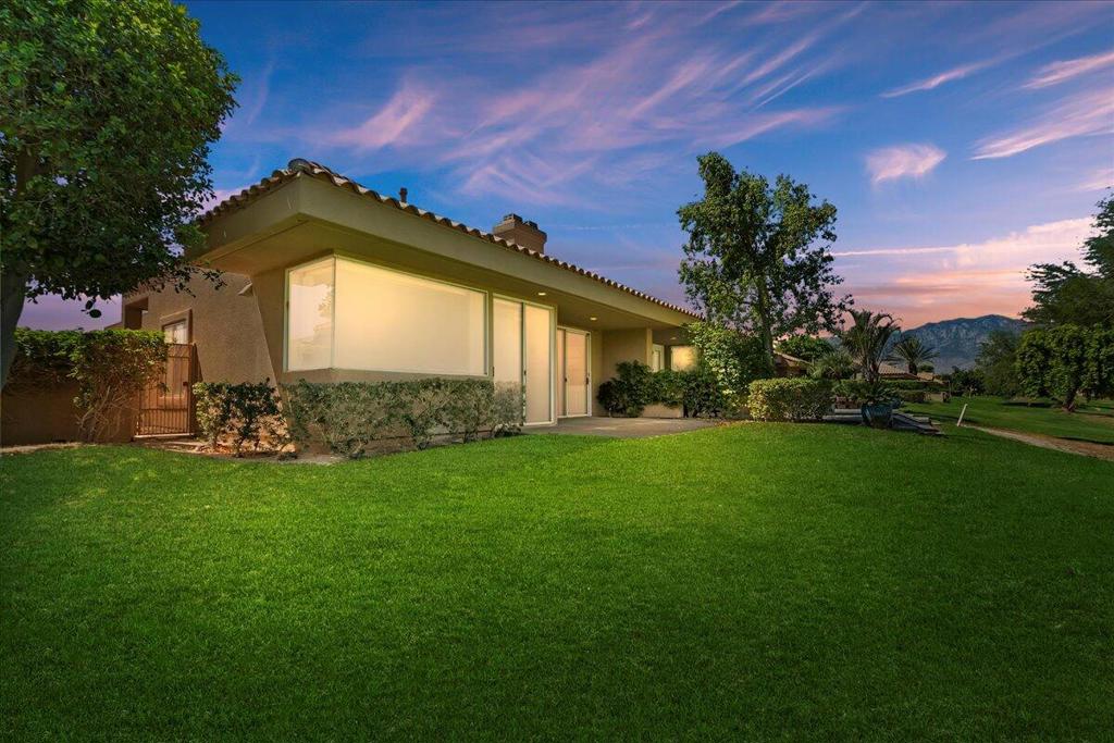 Nestled in the highly sought-after Mission Hills Country Club in the heart of Rancho Mirage this 2259 sq.ft. 'Doral Floorplan' condo boasts a spacious living room with a beautiful gas fireplace, walled wet-bar and back patio sliding door that flaunts incredible views of the Pete Dye Golf Course. The elegant formal dining room directly across from the fireplace sits adjacent to the ideal u-shaped kitchen and breakfast nook that present epic views of the Santa Rosa Mountains. The two master suites have both giant wall and walk-in closets in addition to adjoining master baths with dual sinks, standing showers and soaking tubs. The third bedroom, private rear covered patio and giant three-car garage makes this condo an amazing opportunity for anyone looking for the perfect home with great views, in an elite country club where you 'OWN THE LAND'. The HOA fee covers exterior maintenance of the home, landscaping, cable, trash service, guard gate security, and access to 4 community pools, spas, and the Mission Hills Clubhouse & Westin Resort. Memberships are available to play all three championship golf courses on the property, in addition to clubs for golf, tennis, pickleball, croquet, bocce ball, fitness, and spa services. Experience unparalleled resort living at Mission Hills Country Club just minutes from the Palm Springs Airport, Agua Caliente Resort Casino, and the valley's infamous El Paseo shopping and restaurants district. Call to schedule a tour today!