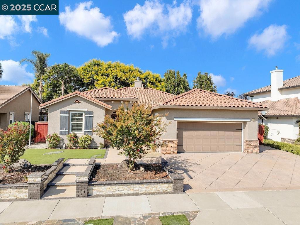 Welcome to this stunning 3-bedroom, 3-bath home with a versatile den/office, perfectly situated in Brentwood’s highly desirable Garin Ranch neighborhood. Just minutes from downtown, top-rated schools, parks, and community events, this home combines convenience with comfort. Step inside to a freshly painted interior that feels bright, open, and inviting. The spacious floor plan offers a seamless flow for both everyday living and entertaining. The living room highlights custom stone accents, a cozy pellet fireplace, and a built-in sound system for the ultimate atmosphere. Enjoy the privacy of no rear neighbors and a backyard designed for gatherings or quiet relaxation. Modern upgrades include solar panels, a Tesla EV charger, new Lennox HVAC system (2024), tankless water heater, water softener, and whole-home audio. With RV/boat parking, no HOA, and easy commuter access to Hwy 4 and Vasco Road, this home truly checks all the boxes. Don’t miss the chance to make this move-in ready beauty your own—schedule your private showing today!