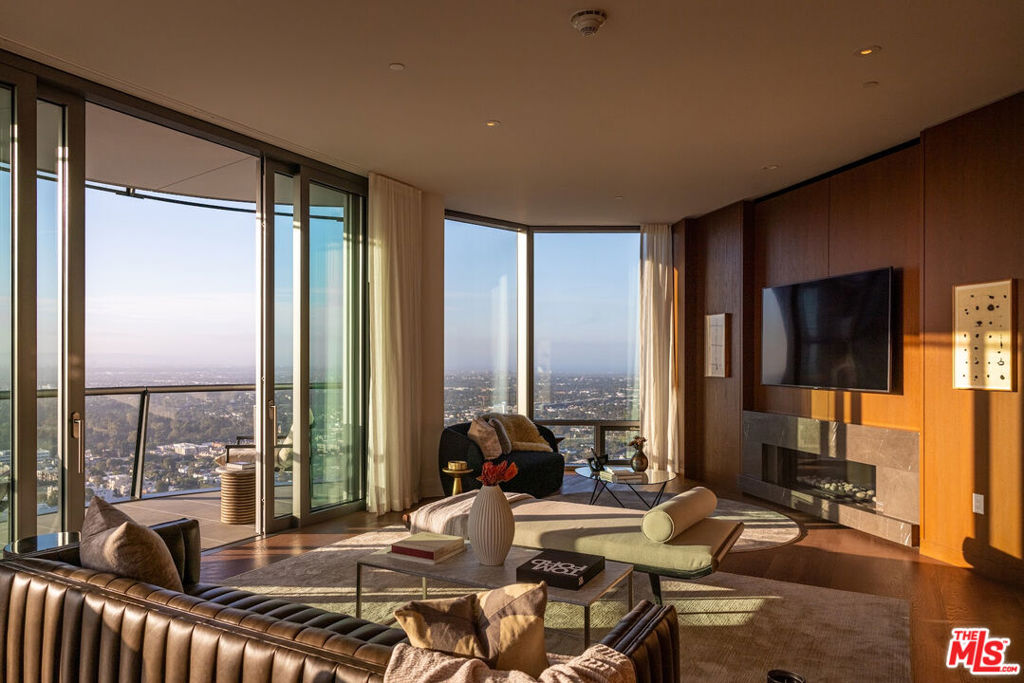Located in the heart of Century City, the legendary glass towers at Park Elm Century Plaza, designed by world renowned architects Pei Cobb Freed & Partners, stand as a striking testament to modern luxury. Rising 44 stories with walls of 10-foot floor to ceiling glass, each residence showcases sweeping panoramic views and a lifestyle defined by elegance, security, and resort-style living with access to world renowned restaurants and retail in the Century Plaza below. Privately sited off the street with 24-hour guard-gate and valet, this dramatic approach welcomes your home. Residents enjoy a curated collection of amenities, including a resort-style pool and hot-tub, state of the art fitness center, access to a full-service spa, private screening room, library, wine storage, game lounge, event space and attentive 24-hour concierge. Every element has been envisioned to enhance life at the highest level. Residence 39A offers 3 bedrooms, 4.5 bathrooms, and approximately 3,916 square feet, complete with a private elevator lobby directly to your unit. A grand entry foyer flows into a spacious great room with fireplace and access to a terrace, complemented by a custom Snaidero kitchen appointed with professional-grade Wolf, Sub-Zero, or Miele appliances. A private den provides versatility for work or relaxation. The primary suite features a spa-inspired bath, an expansive closet, and a private terrace, while secondary bedrooms with en-suite baths are thoughtfully positioned for comfort and privacy. The Park Elm Residences at Century Plaza is more than a home, it is an architectural landmark and an enduring expression of modern elegance just moments away from the best shopping, dining, and lifestyle Century City has to offer.