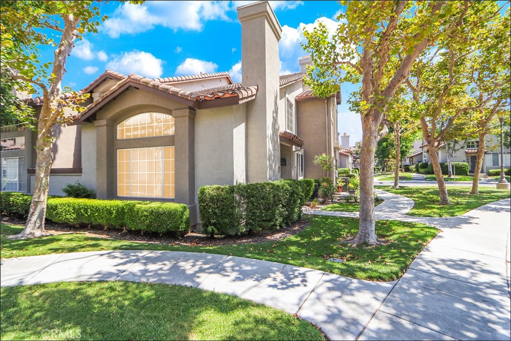SPECTACULAR END UNIT LOCATION WITH VIEW OF LUSH GREENBELTS OFFERING ADDED PRIVACY, UPGRADES THROUGHOUT AND LARGE 2-CAR ATTACHED GARAGE! Highly desirable Windflower gated community within walking distance to nearby Aliso Viejo Town Center! Spacious floor plan offering a large living and dining room with high ceilings and fireplace. Large kitchen with designer Quartz countertops, stainless steel appliances including refrigerator, recessed LED lighting, large windows to bring in plenty of natural light, bar seating and opens to the living areas. This amazing floor plan features the 3rd bedroom at the main floor and bathroom with large walk-in shower. Second story features the primary master suite with vaulted ceilings, large wall-to wall closet with mirrored closet doors and ceiling fan light fixture. Primary master bathroom with large vanity, dual sinks and large tub and shower with glass enclosure and upgraded fixtures. 2nd master with en-suite bathroom featuring tub and shower with glass enclosure and upgraded fixtures. Upgraded flooring and baseboards, fresh interior paint, added and upgraded lighting fixtures and so much more. Enclosed patio facing greenbelts, highly desirable and gated Windflower community with excellent proximity to Aliso Viejo Town Center, shops, restaurants and entertainment, highly sought after schools, easy toll road (73) and beach access (via 133) and nearby hiking, biking and nature trails!