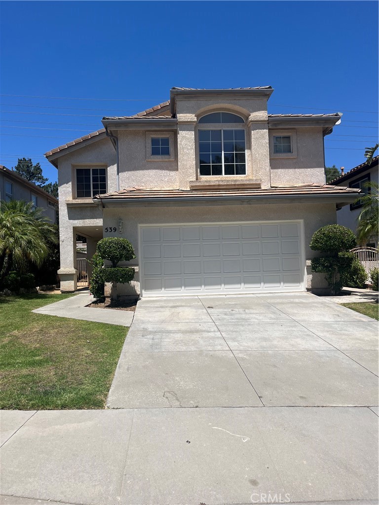 Beautifully maintained 3-bedroom, 2.5-bathroom rental house featuring an attached 2-car garage and stunning outdoor space in an excellent Simi Valley location. Step through the front door into an impressive formal living and dining area with soaring high ceilings that create an open, airy atmosphere perfect for both daily living and entertaining. The main floor flows seamlessly with a spacious U-shaped kitchen that offers abundant natural light from a large window overlooking the backyard, generous cabinet and counter space for all your culinary needs, and an additional living area adjacent to the kitchen. Practical conveniences include a half bathroom for guests, a large storage closet near the staircase for organizational needs, and direct garage access with washer and dryer hookups.
The second floor offers a private retreat with a master suite featuring an ensuite bathroom and dual closets for ample storage. Two additional bedrooms provide spacious closets and share a full bathroom conveniently located in the hallway. The beautifully landscaped backyard provides a perfect setting for relaxation, gardening, or outdoor entertaining, while the attached 2-car garage offers direct home access and houses the washer/dryer connections. This well-maintained property in a prime Simi Valley location is ready for immediate occupancy.