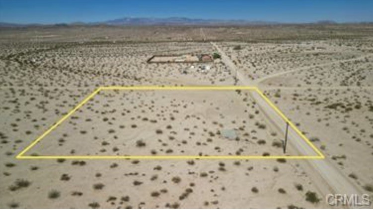 Water in the street along with Power at the lot corner. Build your dream home on this 2.5-acre buildable corner lot in Desert Heights! Located in Desert Heights, which is an unincorporated area of 29 Palms and falls under county restrictions. Expansive views, power, and water available on-site make this lot highly desirable. Not too far from town but far enough. Lots of opportunity. Hard to find a flat buildable lot with all utilities at this price.