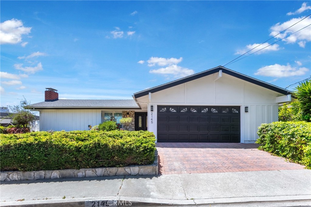 Located in the desirable South Shores neighborhood, this upgraded and remodeled home offers a relaxed coastal lifestyle just minutes from the cliffs of Rancho Palos Verdes, Trump National Golf Club, Cabrillo Beach, and Downtown San Pedro, seafood markets, waterfront dining, and unique local shops. The home welcomes with a landscaped front yard, brick-paved driveway, and an attached two-car garage with EV charging.
Recent upgrades include fresh interior and exterior paint, luxury vinyl plank flooring, modern lighting, central A/C, and full copper repipe. The living room features vaulted ceilings with exposed beams, large windows for natural light, and a fireplace. Sliding doors open to a balcony with peek-a-boo ocean views and stunning sunset skies.
The upgraded kitchen is equipped with stainless steel appliances (oven, range, dishwasher), quartz countertops, and subway tile backsplash. The dining area flows seamlessly from the living space, ideal for everyday meals or casual entertaining.
Each bedroom offers its own upgraded ensuite bath for privacy and convenience. The main-level primary suite is paired with a powder room. The lower level includes two additional bedrooms and a spacious family room—perfect for media, office, or guest use, complete with a second fireplace and backyard access.
The private backyard features a new paved patio, fruit trees, white vinyl fencing, and a new wrought iron gate—perfect for dining, lounging, or creating a peaceful garden retreat. No HOA.