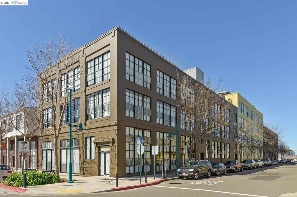 Urban loft in award-winning building! Bright space w/ tall ceilings, huge windows, hrdwd flrs, open floor plan, cement columns, built-in desk system, in-unit laundry, roof-top deck & views of the Oakland Hills. Close to shops, restaurants, public transport & Bay Bridge. Great for commuters!