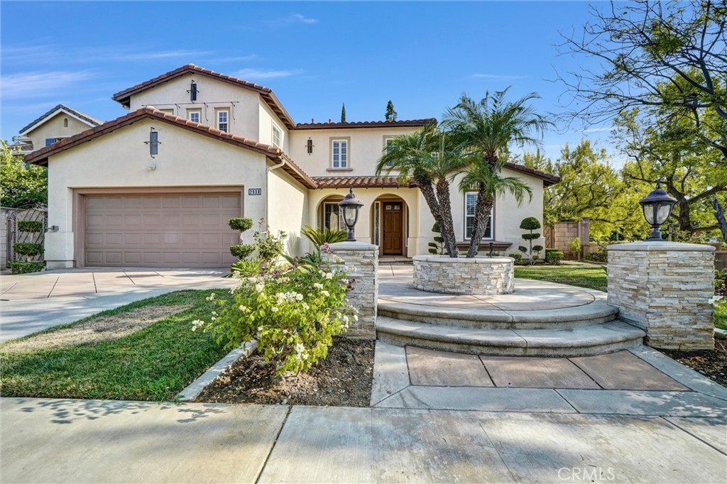 Welcome to Gallery Plan 1 – A Stunning Home in the Prestigious Parkhurst Community of Fullerton! Step into this beautifully updated 3,337 sq ft residence, perfectly located within one of Fullerton’s most sought-after gated neighborhoods. This light-filled, open-concept floor plan offers timeless elegance and comfort throughout. From the moment you enter, you’ll be impressed by the grand foyer with soaring vaulted ceilings that flow seamlessly into the formal living and dining areas. Travertine tile flooring enhances the entryway, kitchen, and family room, adding a touch of luxury and durability.
The chef’s kitchen is a true centerpiece – complete with stainless steel appliances, granite countertops, a large center island, a butler’s pantry, and classic plantation shutters. Crown molding throughout adds a refined finish. Just off the kitchen, the spacious family room offers the perfect space to gather and relax. Downstairs, you’ll find a private bedroom with a full bath and walk-in shower – ideal for guests or multi-generational living.
Upstairs, rich cherry hardwood floors lead you to three generously sized bedrooms, including a luxurious primary suite featuring two walk-in closets
and a spa-inspired ensuite with marble countertops and natural stone finishes. A versatile loft space currently serves as a home office but could easily
be converted into a 5th bedroom. The secondary upstairs bath features updated granite counters, a new shower, and upgraded flooring. Step outside
to your private backyard retreat, thoughtfully designed for outdoor living and entertaining. Enjoy a gazebo and an outdoor kitchen featuring granite countertops, built-in BBQ, side burners and a sink, along with multiple seating areas enhanced by pavers and a charming pergola - perfect for relaxing or hosting guests in style. This home is also equipped with Solar Panels- a great energy-efficient upgrade.
Residents of Parkhurst enjoy resort-style amenities, including three sparkling pools, two relaxing spas, tennis, basketball, and volleyball courts, a clubhouse, and scenic walking trails. Located just minutes from top-rated shopping, dining, and award-winning schools – including the highly acclaimed Golden Elementary with its distinguished GATE program. This is more than a home – it’s a lifestyle. Don’t miss your chance to live in one of North Orange County’s premier communities!