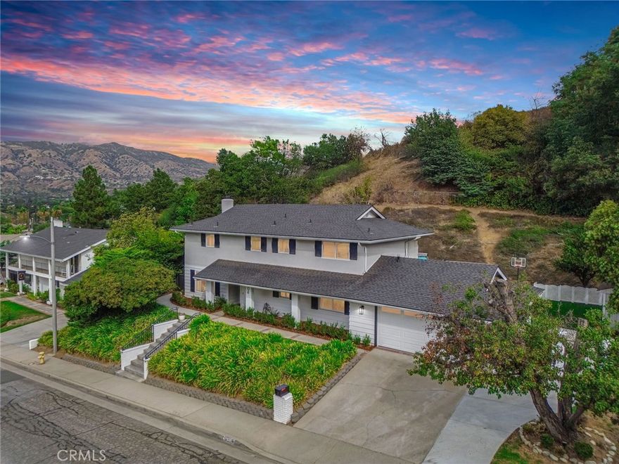 WELCOME HOME! This stunning move-in ready cul-de-sac residence is tucked away in one of Glendora’s most desirable and serene neighborhoods, offering exceptional curb appeal and undeniable pride of ownership. Meticulously maintained and thoughtfully upgraded, this home is a true gem. Step inside to a beautiful entry featuring an inviting open floor plan. Your spacious living room is filled with natural light from oversized windows, anchored by a cozy fireplace and flows seamlessly into your formal dining room—perfect for entertaining. Your bright and open kitchen, with brand new appliances, connects to a large family room, where you’ll enjoy picturesque views of your lush, park-like yard. Your downstairs features a full bathroom with a walk in shower. Outside, your backyard oasis awaits with mature landscaping, a sparkling pool, an expansive patio ideal for outdoor dining and serene mountain views, creating the perfect space to relax or host gatherings. Upstairs, your generous primary suite offers a large walk-in closet and a beautifully appointed bath with dual sinks, a walk-in shower and a private water closet. Three additional spacious bedrooms and an updated full bathroom complete your upper level. Recent upgrades include: newer flooring throughout, new roof, new insulation in attic, a 200 amp electrical panel, stylish new light fixtures, newer dual-pane windows, new pool pump, new pool heater, a large storage shed, epoxy-finished garage floors and so much more! Situated on a generous 14,810 sqft. lot, this 2,288 sqft. home offers 4 bedrooms, 3 bathrooms, and all the space you need to live and entertain comfortably. Located within the highly acclaimed Glendora Unified School District and just minutes from the 210 and 57 freeways, shopping, dining, and more.