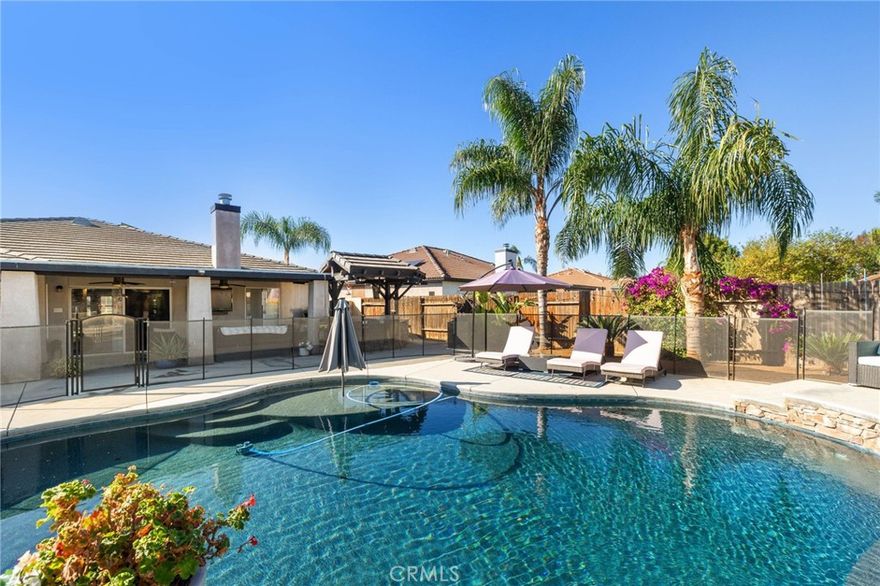 An entertainer’s backyard, flexible floor plan, and quiet cul-de-sac location make this one of the most desirable homes in the top-ranking Norris School District. Step inside this immaculately maintained home to find formal living and dining areas—perfect for hosting the upcoming holidays. Wood-look tile extends through the formal spaces to the great room, featuring a fireplace, kitchen with granite counters, stainless steel appliances, pantry, and breakfast nook. Just off the main living area, the enclosed office offers flexibility for a 4th bedroom. The primary suite includes an oversized bedroom and spa-like bath with walk-in shower, while each additional bedroom has a walk-in closet. Outside, enjoy a Pebble Tec pool with waterfalls and tanning ledge, plus a custom outdoor kitchen with Santa Maria grill, Blaze BBQ, refrigerator, granite counters, and dual TVs. The finished garage offers epoxy floors, built-ins, roof racks, and Culligan water softener. Too many upgrades to list.