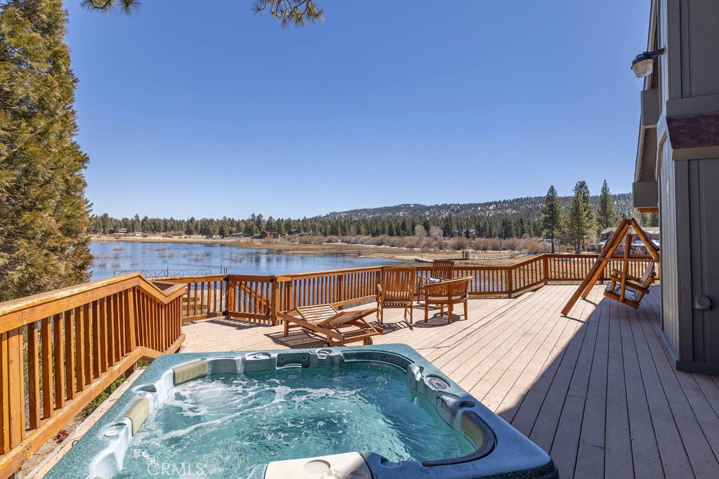 Welcome to 657 Cienega, a stunning lakeside retreat in Big Bear Lake that seamlessly blends modern luxury with waterfront living. This exquisite home, offers breathtaking lake views and a three-boat dock slip, making it a perfect haven for water enthusiasts.
Step inside to discover an open floor plan that exudes elegance and comfort. The spacious living area flows effortlessly into a large kitchen, complete with multiple workstations, a double oven, and a breakfast bar—ideal for entertaining family and friends. The wrap-around deck provides an outdoor covered eating area, perfect for enjoying meals with a view.
The home features four bedrooms, including two downstairs with en-suite bathrooms. The primary bedroom is a true sanctuary, boasting a large jet soaking tub, steam shower, and dual closets. Upstairs, you'll find two additional spacious bedrooms and a third bathroom. While the home has been beautifully modernized, it retains a touch of history with the original claw foot tub, a nod to its previous owner, the legendary Roy Rogers, or so the ledge goes.
Experience the best of lakeside living with a wrap-around deck offering spectacular views, especially during the 4th of July fireworks.
This home is ideally located within walking distance to Boulder Bay and Pleasure Point Marina, and just a five-minute drive to the village, offering both convenience and tranquility. Featuring an attached three-car garage, this property combines practicality with beauty.
Don't miss the opportunity to own this unique piece of Big Bear Lake history, where modern luxury meets classic allure.