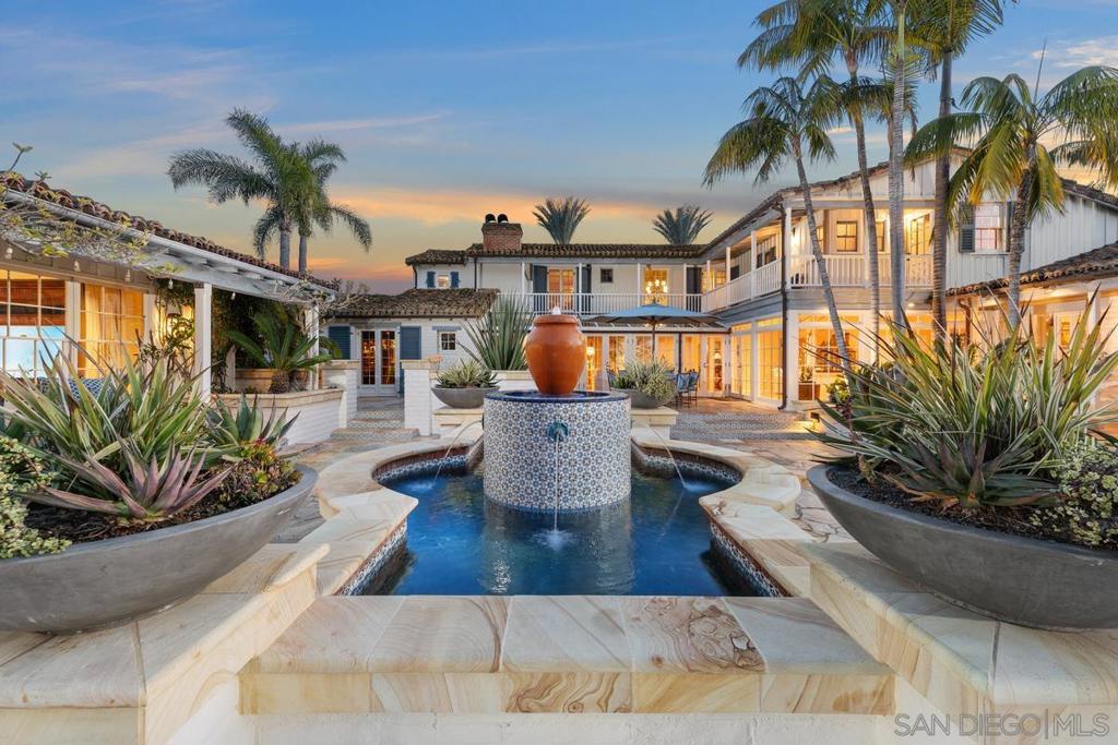 On an expansive, all usable and private six-acre parcel - Welcome to 16337 Los Arboles in Rancho Santa Fe Covenant. This Monterey Spanish-Colonial seamlessly blends historic Charm with Modern Luxury. A meandering driveway leads you up and over cascading waterfalls, past a Tennis/Sports Pavilion and 8-Stall Barn, unveiling immaculate mature landscaping and a true sense of arrival. The main residence, an original Lilian Rice core that was expanded later, offers effortless single-level style living with multiple guest homes, including a true Ranch-Hand Home + 2 Detached Guest Homes, and Breathtaking Views. Designed for both grand entertaining and serene retreat, the estate boasts an expandable Equestrian Arena, a resort-style New pool, a state-of-the-art Wellness/Gym retreat, an outdoor Movie Theater, and the finest card room in San Diego. Cutting-edge Sonos surround sound and Starlink connectivity enhance the experience, while tranquil fountains elegantly grace the grounds and create an oasis reminiscent of an elaborate and private Rancho Valencia Resort. This is luxury redefined—a sanctuary of beauty, comfort, and sophistication with 10-car garage, 8+ bedrooms and over 10,000 sq. ft. of premier Southern California living. *Selling Furnished w/ Art. Some exclusions*