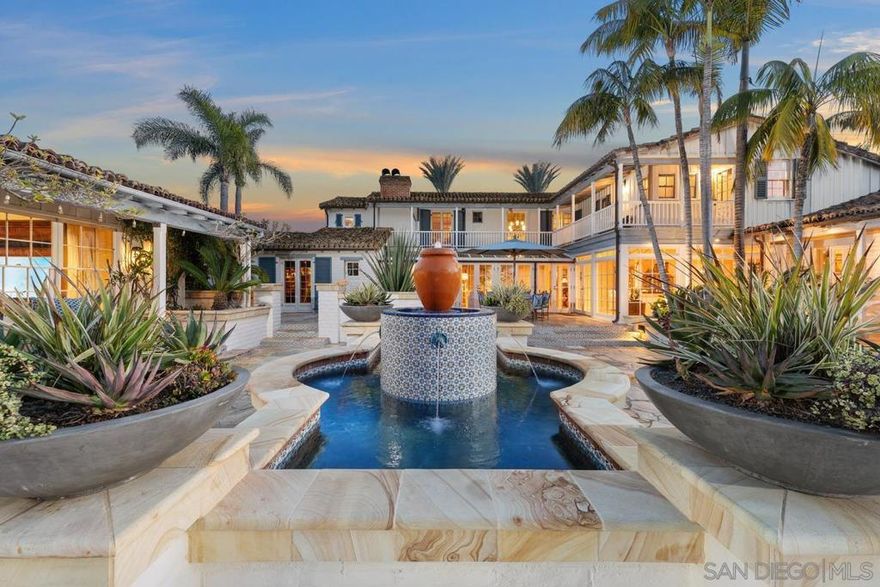 On an expansive, all usable and private six-acre parcel - Welcome to 16337 Los Arboles in Rancho Santa Fe Covenant. This Monterey Spanish-Colonial seamlessly blends historic Charm with Modern Luxury. A meandering driveway leads you up and over cascading waterfalls, past a Tennis/Sports Pavilion and 8-Stall Barn, unveiling immaculate mature landscaping and a true sense of arrival. The main residence, an original Lilian Rice core that was expanded later, offers effortless single-level style living with multiple guest homes, including a true Ranch-Hand Home + 2 Detached Guest Homes, and Breathtaking Views. Designed for both grand entertaining and serene retreat, the estate boasts an expandable Equestrian Arena, a resort-style New pool, a state-of-the-art Wellness/Gym retreat, an outdoor Movie Theater, and the finest card room in San Diego. Cutting-edge Sonos surround sound and Starlink connectivity enhance the experience, while tranquil fountains elegantly grace the grounds and create an oasis reminiscent of an elaborate and private Rancho Valencia Resort. This is luxury redefined—a sanctuary of beauty, comfort, and sophistication with 10-car garage, 8+ bedrooms and over 10,000 sq. ft. of premier Southern California living. *Selling Furnished w/ Art. Some exclusions*
