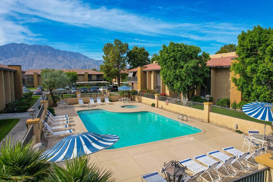 Get ready to experience the perfect blend of resort living and everyday comfort! This 3-bedroom, 2-bathroom condo is your ticket to the sought-after gated community of Cathedral Springs in sunny Cathedral City. It truly has a little bit of everything!This charming condo has an open concept living: The home centers around a bright, open kitchen perfect for entertaining. Enjoy seamless interaction with your guests while they relax in the dining area or perch at the convenient bar seating. The private primary suite is a true retreat. It boasts an updated master bathroom walk through primary closet,  and direct access to a private patio. The private patio is accessible from both the primary bedroom and the second bedrooms the ideal spot for morning coffee or evening cocktails where you can enjoy  the gorgeous mountain views. Enjoy outside your door one of the four community pools, tennis courts for your match-day fun, and a full clubhouse. And since it's gated, peace of mind is part of the package!