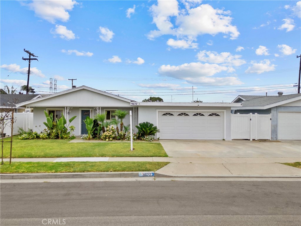 Beautifully Remodeled 3 Bdrm and 2 Bath Home with a HUGE YARD. It Features a Light-Filled Living Room with Recessed Lighting, Scraped Ceilings, and Warm Hardwood-Style Floors that flow into the Dining Area and Chef-Inspired Kitchen. The Kitchen has Expansive Quartz Countertops, a Large Breakfast Bar, Stainless Appliances, and Crisp White Cabinetry. The Spacious Primary Suite features a Generous Closet and Spa-Like Bath with Custom Tile, Pebble Shower Flooring, and Modern Fixtures. Both Additional Bedrooms offer Ceiling Fans and Ample Storage, the Remodeled Hall Bath has a Stunning Shower/Tub Combo. Outside, your HUGE Private Backyard with a Concrete Patio and Lush Lawn is the Ultimate Spot for Relaxation or Hosting Friends. Two-Car Garage With Rear Pass-Through, and a Prime Location Near Beaches, Parks, Shopping, and Dining. Don’t Miss your Chance to Call this Turnkey Beauty, Home!