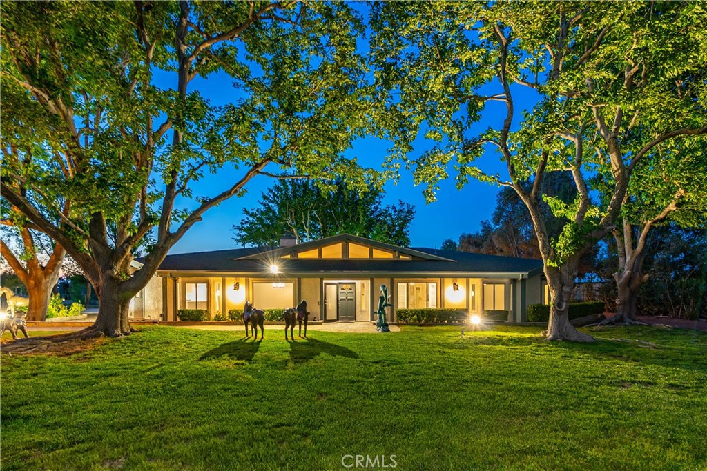 ***LIVE BEAUTIFULLY*** FOR SALE OR FOR RENT! One-Of-A-Kind Park-Like Equestrian Estate With A Studio/ Guest House On A Fully Fenced Near 2.5 Acre Lot! Great Business Opportunity To Train and or Board Horses! Main House Offers 4 Beds and 2.5 Baths, Guest House is Nearly 600 Sq Ft and Offers A Fully Bathroom! Gorgeous Mature Trees (Possibly Nearly 100 Years Young), Lush Green Grass, And An Electric Gated Driveway. NEWER A/C Units, NEW Windows, NEWER Septic Tank, NEWER Roof (2019), And A Water Filtration System For The Whole Main House & Studio/Guest House! Formal Dining Room w/ An Electric Drape, Modern Chandelier, And Large Window for Front Yard Views! The Great Room Offers Massive Windows That Creates Plenty Of Natural Lighting, A Wet Bar, And A Cozy Fireplace. NEW Attic Insulation. The Grand Gourmet Kitchen Has Been Completely Remodeled And Boasts A Superabundance Amount Of Custom Cabinetry, Tile Backsplash, Electric Blinds, LED Lighting, Stainless Steel Appliances, And A Massive Center Island w/ A 5 Burner Cooktop And A Pot Filler! NEW Interior Paint & Upgraded Baseboards Enriches The Home. The Primary Suite Showcases A Retreat Area w/ A Wet Bar, Patio Access, 2 Walk-In Closets, Custom Vanities, And A Renovated Primary Bath w/ A Stone-tiled Shower w/ 2 Shower Heads, And A Bidet w/ Many Functions Including A Warming Option. NEW French Doors Leading To The Backyard. Stunning Stain Glass Windows From The Garage To The Patio. Orange Tree In The Backyard! Around 600 Sq Ft Studio/ Guest House w/ A Full Bathroom! Many Equestrian Facilities Including 4 Horse Stalls, A Tack Room, An Arena w/ Lighting, 2 Storage Sheds, And A Workshop! This Amazing Equestrian Estate, Built w/ Grace And Love, Is A MUST See!