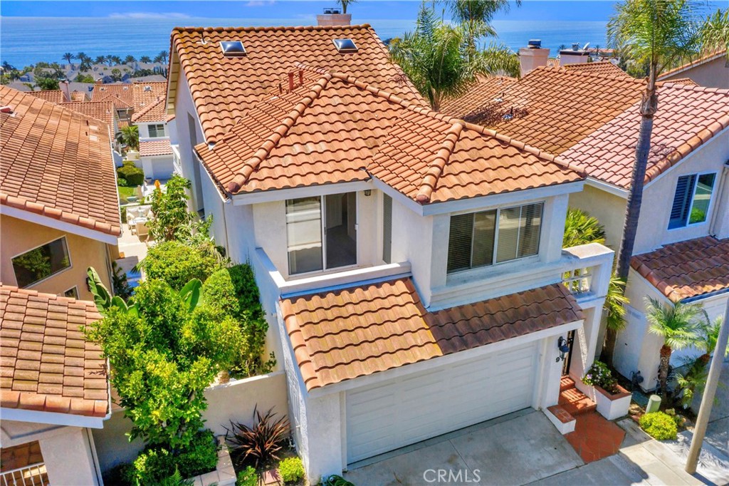 Luxury single family home located in the exclusive gate guarded community of Regatta in Monarch Beach. Located just a few blocks from Strands and Salt Creek beaches and the wondrous Headlands Trails. Gorgeous Ocean, Catalina and Sunset views from most areas throughout the home. Kitchen opens up to dining and great room with ocean views from all. There is a large ocean view deck off the great room to enjoy the morning sunrise and evening sunsets. Ocean view master bedroom with fireplace leads out to the backyard patio. There are 2 other bedrooms upstairs which each have access to a spacious balcony.