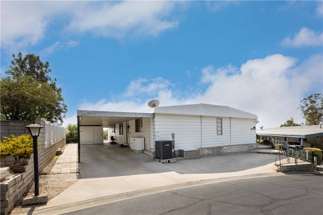 Gorgeous Triple-Wide Home with Panoramic Views!
Step into this beautifully renovated 2,108 sq ft triple-wide located in the highly desirable 55+ gated community of Mountain Shadows in Highland. With sweeping mountain views and a layout designed for both comfort and accessibility, this home is a rare find.
Thoughtfully upgraded for ease of living, it features wide arched doorways, a gentle entry ramp, roll-in shower, roll-under sinks, and strategically placed grab bars—perfect for those seeking a more accessible lifestyle.
Recent updates include a new HVAC system, wood-look flooring, fresh interior finishes, and a fully remodeled kitchen and primary bath. The roof has been treated with a durable, weather-resistant sealant, and the exterior is enhanced with updated lighting and four Ring security devices.
Inside, enjoy a light-filled living and dining area with wall-to-wall windows, plantation shutters, and a cozy gas fireplace. A separate family room offers built-in shelving, a second fireplace, and sliding doors that open to the outdoors.
The kitchen is a true showpiece, featuring custom cabinetry with soft-close organizers, butcher block countertops, and all-new appliances. The sunny dining nook is perfect for casual meals or entertaining.
The primary suite is oversized and serene offering a peaceful retreat with generous space and comfort.
Mountain Shadows offers a beautifully appointed clubhouse with a banquet hall, lounge, library, and big-screen TV area. Residents enjoy a heated pool, spa, saunas, fitness center, and billiards room—all just steps from your door.
Conveniently located near shopping, dining and just a short drive to Lake Arrowhead, Big Bear, and the San Bernardino National Forest, this home offers the perfect blend of relaxation and active senior lifestyle.