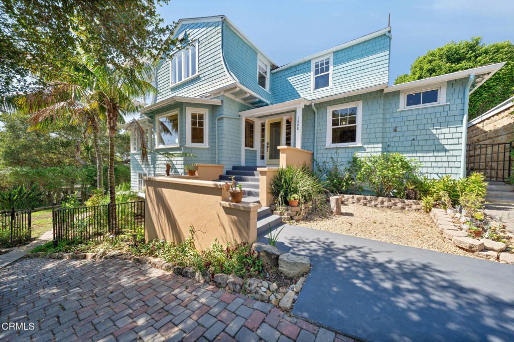 Set against the backdrop of Santa Barbara's storied Riviera, this private 1920s Craftsman residence carries both architectural pedigree and timeless charm. Originally envisioned by famed architect Francis W. Wilson for Madame Elise Bachmann, a pioneering New York dressmaker and one of the first to build on the Riviera, this home stands as a hallmark of the neighborhood's early elegance and enduring spirit.Showcasing sweeping ocean and city views, the main residence blends the warmth of wood-paneled living spaces with refined period details. The home offers three bedrooms and three baths upstairs, plus a bedroom, office, TV room, and full bath on the main level, creating a flexible layout ideal for modern living. Thoughtful updates including a remodeled kitchen and baths, newer cabinetry, and built-ins preserve the integrity of the home's craftsmanship while introducing everyday comfort.A legal guest apartment with private entrance sits below, perfect for guests or extended stays, complemented by two two-car garages and a fenced yard surrounded by mature landscaping on approximately one quarter acre.Positioned in a quiet pocket near the Mission, El Encanto Hotel, Roosevelt Elementary, and just moments from downtown Santa Barbara, this home carries the grace of the Upper East with the serenity of the Lower Riviera.More than a residence, this is a rare opportunity to own a piece of Santa Barbara history, the first home ever built on the Riviera and a testament to the vision and independence of a woman who helped shape the city's early cultural landscape.