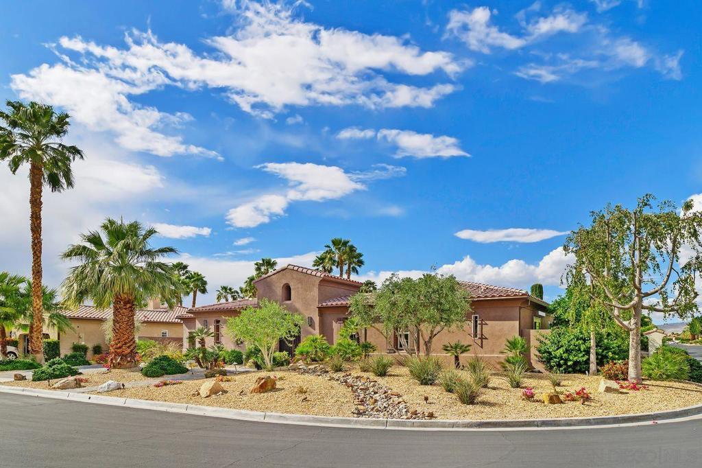 Located in the prestigious city of Rancho Mirage, this gorgeous four-bedroom, four-and-a-half-bath home offers luxurious desert living at its finest. Nestled in the coveted gated community of St. Augustine, this residence features an expansive open-concept layout that seamlessly connects the living room, dining area, and chef's kitchen—perfect for entertaining. The kitchen is a culinary dream, equipped with a Sub-Zero refrigerator, Wolf range, oversized island, and a generous walk-in pantry. The home has been recently re-tiled throughout, adding a sleek and modern touch. The spacious primary suite includes a cozy sitting area and a spa-like bathroom with dual vanities, a large walk-in shower, and an impressively oversized custom walk-in closet. All guest bedrooms feature en-suite bathrooms, and one can easily be converted into a casita—offering ultimate privacy and comfort for visitors. A versatile bonus room adapts effortlessly to your needs. Step outside to your private backyard retreat, complete with a sparkling saline pool and soothing spa—just moments from the primary suite. Additional highlights include a two-car garage with its own A/C unit, a 42-panel leased solar system, and low HOA dues of just $400/month, which include cable. Community amenities feature tennis courts, scenic walking paths, lush greenbelts, ponds, and streams. This home exudes pride of ownership and is truly a gem!