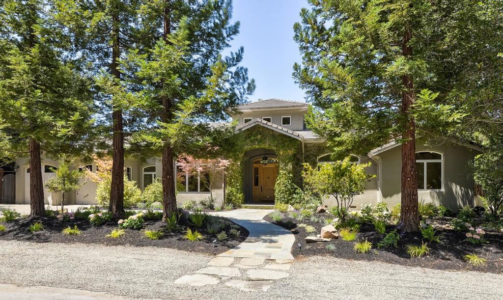 Welcome to estate quality living in one of the best spots in North Los Altos. Positioned on almost one-half acre in a neighborhood of non-through streets, the home is just short blocks to an acclaimed elementary school & only one mile to all the downtown amenities in the Village. Spanning two levels of exceptional craftsmanship, the solar-powered home is complemented by a spacious guest house that doubles as a wonderful venue for poolside entertaining. Beautiful hardwood & travertine floors & towering ceilings combine for an ambiance of sophisticated luxury for entertaining yet ever so warm & inviting for everyday living. Grand formal rooms precede a gourmet kitchen & family room combination, plus there is a large recreation room & temperature-controlled wine cellar on the lower level. Fresh-air living awaits with a heated lanai & barbecue center, a sun-swept solar-heated pool & bountiful farm-to-table gardens with 6 raised vegetable beds, herb garden beds & numerous mature fruit trees
