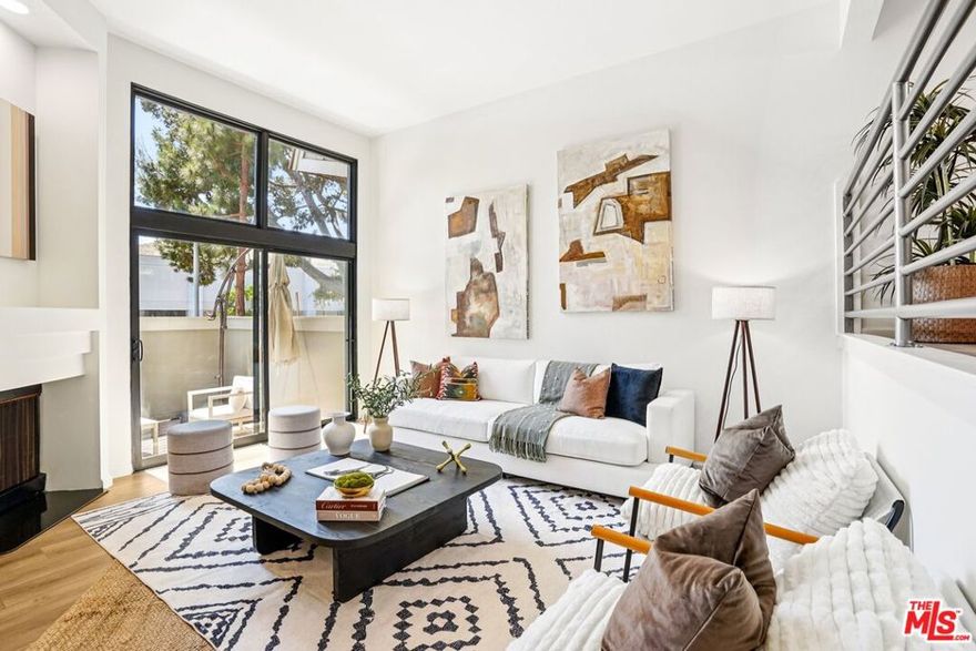 Don't miss this amazing coastal elegance at a stylish tri-level townhome tucked within the coveted Villa Velletri community of Marina del Rey. This spacious two-bedroom, three-bath home combines well-planned architecture with modern updates, offering a bright, inviting atmosphere. Inside, you'll find tall ceilings, brand-new hardwood floors, and freshly painted interiors that create a crisp, contemporary feel. The split-level layout is designed for both comfort and entertaining. A formal dining area overlooks the sunlit living room, where a cozy fireplace and sliding glass doors open to a private patio. Here, you can enjoy al fresco dining, morning coffee, or evening gatherings while savoring the refreshing coastal breeze. Just off the dining area, a built-in wet bar adds a touch of elegance perfect for mixing cocktails, serving wine, or creating a stylish coffee station when entertaining guests. An in-unit laundry room with side-by-side washer and dryer also makes daily living seamless. Upstairs, you'll find two bedrooms, each with their own en-suite bathroom. The light-filled primary suite offers tall ceilings, abundant closet space, and a private bath retreat, while the second en-suite bedroom works beautifully as a guest suite, office, or creative studio providing flexibility to suit any lifestyle. Additional highlights include 2.5 bathrooms in total, a private two-car garage with extra storage, and direct home access for convenience. Within Villa Velletri, residents enjoy a rare sense of tranquility. Meandering pathways, mature landscaping, and leafy canopies create a peaceful backdrop that feels worlds away from the city. The community is complemented by resort-style amenities including four sparkling pools, soothing spas, a welcoming clubhouse, and abundant guest parking all designed to elevate everyday living. Beyond the community, the best of Marina del Rey living awaits. Enjoy the coastal lifestyle just minutes from sandy beaches, the marina, and the scenic bike path. Nearby, discover trendy cafes, gourmet restaurants, and boutique shops, or catch the latest release at the AMC Dine-In Marina theater. For convenience, Tesla Supercharging stations are close at hand, and the weekly Farmers Market nearby brings fresh local flavors to your doorstep. This is a rare opportunity to own a stylish townhome in one of Marina del Rey's most desirable communities where serenity, convenience, and coastal charm come together seamlessly.