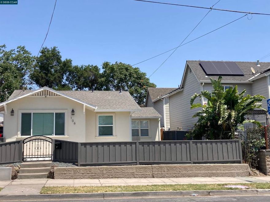 December Special! Pack your bags! This charming bungalow is cute-cute-cute and checks all the boxes! If you like to cook, you'll love the open concept living with its shiny new kitchen featuring shaker cabinets, quartz countertops & a gorgeous waterfall breakfast bar & gas range. The adjacent dining/living room is wired for your big screen TV above the modern electric fireplace. Three bedrooms and the remodeled bath showcases a generous walk-in custom tiled shower and additional storage. Slide the barn door to find your new laundry closet! New luxury vinal plank flooring throughout. New front concrete patio and landscaping with custom wrought iron gates and a private fenced backyard round out the package. Close to shopping, restaurants, schools & public transportation with a public park across the street! Don't miss it!