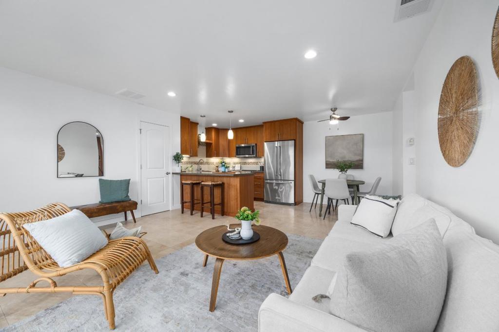 The beach is within reach! This charming 1 Bedroom, 1 Bath condo offers the quintessential Santa Cruz beach lifestyle in a location that is truly second to none. Just down the street from iconic Blacks Beach and bordering serene Schwan Lagoon, this single-level gem is move-in ready and feels fresh as new. Enjoy a bright, airy interior with abundant natural light, granite counters with a breakfast bar, stylish pendant and under-cabinet lighting, stainless appliances and generous storage throughout. The private fenced patio offers a perfect spot for morning coffee or evening relaxation. A covered carport adds convenience, while community amenities include a heated pool, fitness center, clubhouse, green space, BBQ area and even a tranquil koi pond! Whether you're a first-time buyer, looking to downsize, or searching for the perfect coastal retreat, this is a fantastic opportunity. Grab your board, towel, or picnic basket and stroll to the sand...no car required! Twin Lakes Beach, the Santa Cruz Harbor, and the Live Oak Farmers Market are just moments away, with beloved spots like Lago di Como, Windmill Cafe, and Los Pericos Market right around the corner. Come for a beach walk, stay for a lifetime.