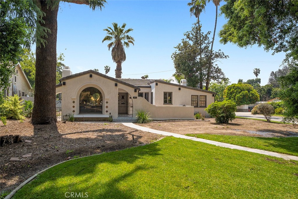 Welcome to Casa Bella—an exquisite Spanish-style home nestled in the scenic foothills of San Bernardino. This beautifully renovated residence blends the timeless charm of the 1930s with modern upgrades throughout. Located on a spacious corner lot, the property offers privacy, tranquility, and convenience with easy access to the 210 and 215 freeways.
The chef’s kitchen features semi-custom cabinetry, white marble countertops, a farmhouse sink, and stainless steel appliances. The large family room is filled with natural light and highlighted by a classic fireplace and original architectural details. The home includes four generously sized bedrooms—two with en-suite bathrooms—plus an additional guest bath, providing a versatile layout for families, guests, or multi-generational living.
A separate home office offers beautiful views of mature trees and landscaped grounds. Original windows, charming courtyards, and period details have been thoughtfully preserved, adding to the home’s unique character.
Outdoors, enjoy a private swimming pool, classic brick fireplace, and multiple sitting areas ideal for entertaining or relaxing. Additional highlights include updated systems, abundant parking, and no HOA.
Located near Cal State San Bernardino, shopping, dining, and hiking trails, Casa Bella is a rare opportunity to own a distinctive home in a peaceful and established neighborhood.