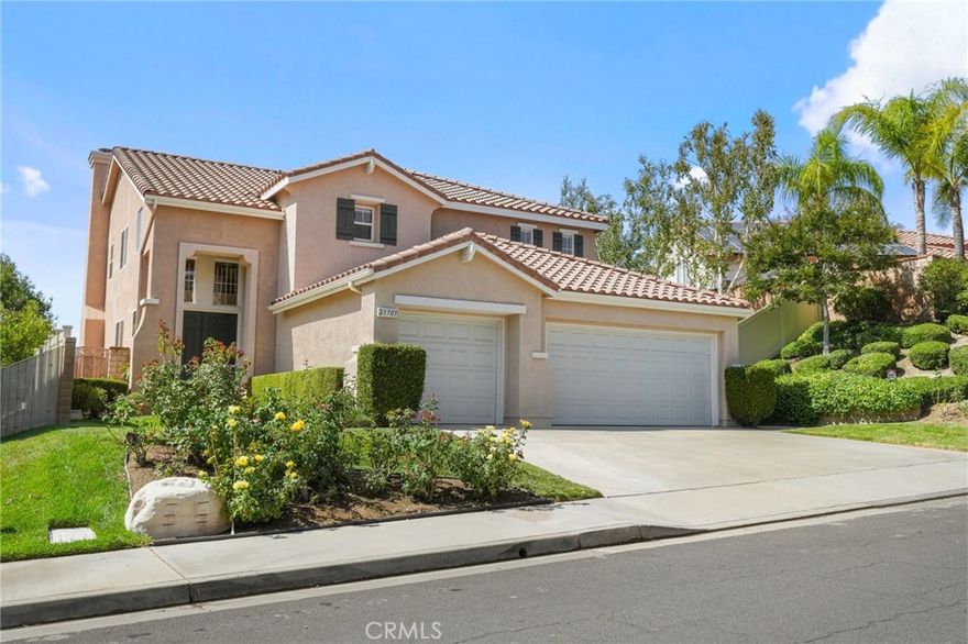 Located on a peaceful cul-de-sac in the desirable Lantana Hills community of Newhall, this beautifully maintained residence offers the perfect balance of space, comfort, and modern updates. Built in 2002, it features approximately 2,756 square feet of living space on a generous 7,364 square foot lot.



The interior is filled with natural light thanks to high ceilings and expansive windows throughout. The main level is ideal for both everyday living and entertaining, with engineered hardwood flooring and a thoughtfully upgraded kitchen that includes quartz countertops, custom cabinetry, and premium Thermador appliances. The kitchen opens directly to a spacious living area, creating a seamless and inviting layout.



A downstairs bedroom with an adjacent updated bathroom provides a perfect guest suite or flexible private quarters. Just behind the kitchen, a dedicated laundry room offers extensive storage and access to the backyard for added functionality and convenience.



Upstairs, a large open loft offers versatility for a home office, media room, or creative space. The primary suite serves as a private retreat, complete with two walk-in closets and a spa-like ensuite bathroom featuring dual vanities, a soaking tub, and separate shower. Two additional bedrooms share a full bathroom with a double vanity, offering both comfort and practicality.



Step outside to discover a private backyard designed for relaxation and entertaining. An extensive covered patio serves as an "outdoor" living room—perfect for dining, lounging, or gathering—framed by mature landscaping and sweeping hillside views. The peaceful setting offers privacy and a beautiful natural backdrop.



Additional highlights include a three-car garage, ample driveway parking, and well-maintained front and rear yards. Residents of Lantana Hills enjoy access to a community pool and spa, all with low HOA dues. The location is convenient to top-rated schools, local parks, shopping, and major freeways—providing easy access to the San Fernando Valley and Los Angeles.



With thoughtful design, quality upgrades, and inviting indoor-outdoor living, this home is a standout example of relaxed California living. Don’t miss your chance to call it home!