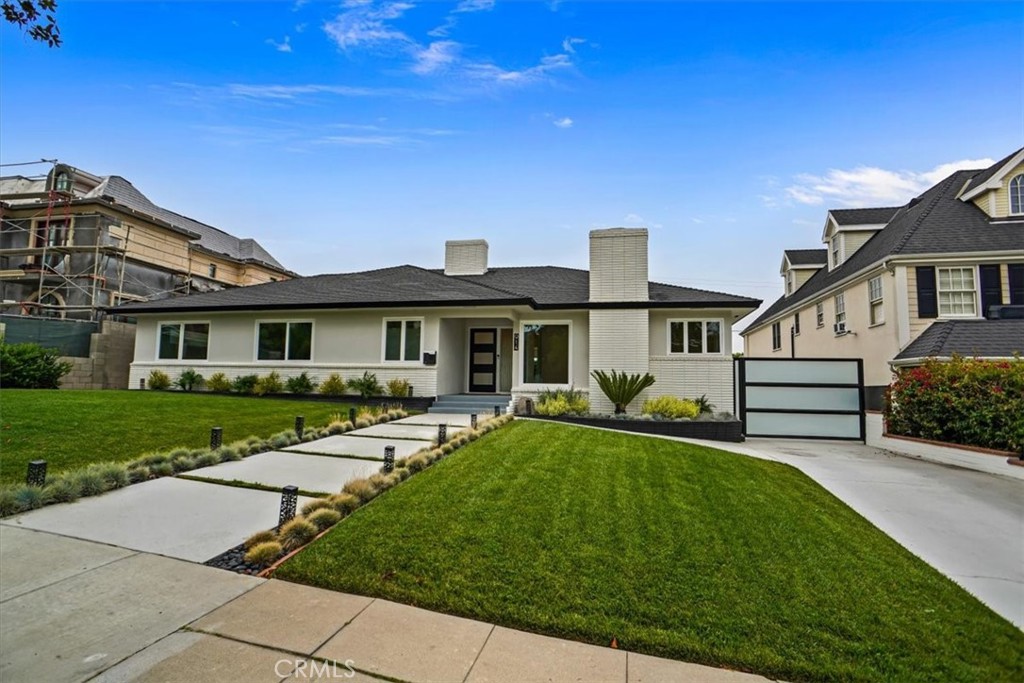 Welcome to this stunning, recently renovated luxury residence situated on one of Burbank’s most coveted and picturesque streets Grinnell Drive. Boasting 5 spacious bedrooms and 3.5 designer bathrooms, this home seamlessly blends timeless elegance with modern sophistication.
Step inside to discover a sun-drenched interior filled with natural light from oversized windows throughout. The formal living room and separate family room each feature a cozy fireplace, perfect for intimate evenings or stylish entertaining. At the heart of the home is a beautifully appointed open-concept kitchen, outfitted with top-of-the-line Thor and KitchenAid appliances, custom cabinetry, and sleek finishes designed for both form and function.
The thoughtfully designed floor plan includes a convenient in-house laundry room and an expansive rear patio that opens to a lush, private backyard—an ideal setting for outdoor dining or future plans for a pool and spa.
A standout feature is the finished three-car garage with soaring vaulted ceilings and exposed beams—ideal as a studio, gym, or potential ADU. Additionally, a separate guest unit with its own kitchenette and bathroom offers incredible flexibility for hosting guests or in-laws.
This rare offering combines modern luxury, versatile space, and unbeatable location—all in one exceptional property. Don’t miss your chance to experience the best of Burbank living.