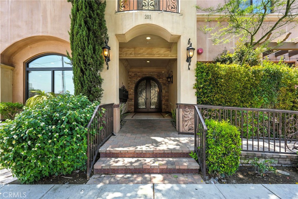 Stunning luxury condo at Villa Verdugo in the heart of Burbank. This custom boutique building of only 12 units was newly built in 2017. Spacious 4 bed + 4 bath floor plan with lots of open space. The kitchen is beautifully equipped with stainless steel appliances, a spacious island, soft close cabinetry, and beautifully appointed finishes. The living area features impressive floor to ceiling sliding glass doors that allow natural lighting in living room accompanied by a contemporary fireplace. Private patio with mature hedges. Discreet laundry area in airy hallway leading to bedrooms. Master bedroom features a pleasantly ample walk-in closet. Private parking underground with elevator access from the garage. Conveniently located next to trendy restaurants, shops, studios, and the best Burbank schools.