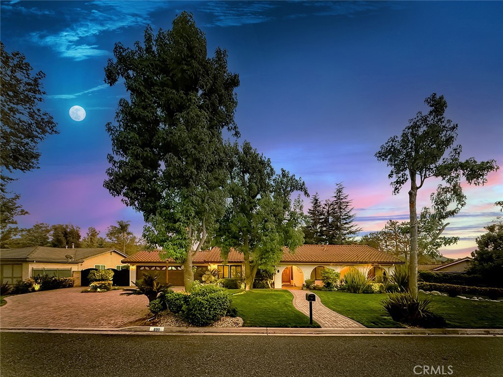 Discover your dream retreat in Montgomery, one of West Simi Valley’s most sought-after equestrian neighborhoods. This beautifully upgraded single-story estate offers 4 spacious bedrooms, 3 bathrooms, and nearly 2,400 sq ft of living space on a sprawling, flat 0.6-acre lot surrounded by mountain views and quiet tree-lined streets.
Step through the arched entryway and into a home filled with character and warmth. Inside, soaring wood-beam ceilings, a cozy brick fireplace, and large picture windows create a light-filled, inviting atmosphere. The open-concept living and dining spaces flow seamlessly into the chef’s kitchen, complete with Thermador appliances, granite countertops, a center island, and an oversized walk-in pantry designed for the culinary enthusiast. A charming wood-beam breakfast nook overlooks the backyard, making everyday moments special.
The private primary suite offers a spacious retreat with direct access to the backyard, a spacious closet space, and a private bathroom. All bedrooms are generously sized, with two featuring custom built-ins ideal for work, study, or storage. The upgraded hallway bathroom boasts a sleek walk-in shower, while the third bathroom adds convenience for family or guests. The laundry room has extensive cabinetry making organization effortless.
Outdoors, this property is truly a sanctuary. A sparkling pool and spa anchor the entertainer’s backyard, accompanied by a large wood-beam gazebo, A cover patio with a Santa Maria fireplace, Space for BBQ, and outdoor dining—perfect for gatherings day or night. Garden boxes and an abundance of fruit trees, including a variety of citrus, peaches, and figs, add charm and functionality to the lush, mature landscaping. All will enjoy the spacious play area, while multiple seating areas provide quiet spaces to relax.
For equestrian enthusiasts, the estate includes a multi-stall barn, corral space, and easy access to neighborhood arenas and riding trails. Practical amenities include a 2-car garage, expansive driveway, and gated RV/boat/toy parking behind custom iron gates—plenty of room for all your vehicles and recreational needs.
Set in a quiet neighborhood surrounded by natural beauty, hiking paths, and equestrian trails, this residence blends sophistication, comfort, and country charm. Rarely does a property combine indoor elegance, outdoor living, and equestrian lifestyle so seamlessly. we welcome home to 890 Mellow Lane.
