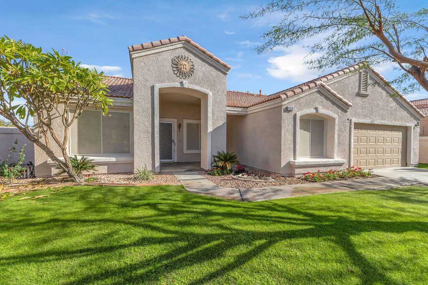 Located in the desirable Topaz community of North La Quinta, this single-story 3 bedroom, 2 bathroom home offers 1,428 sq ft of well-designed living space with no HOA dues. Set on a generous lot with plenty of room to build a pool, the property combines privacy, functionality, and desert-style living.Inside, you'll find an open and airy floor plan with vaulted ceilings, saltillo tile flooring, and abundant natural light. The spacious living and dining areas flow seamlessly and feature a cozy fireplace and sliding glass doors that open to the backyard, creating an ideal indoor-outdoor connection. The kitchen offers ample cabinetry, generous counter space, and a casual breakfast nook overlooking the yard. The primary suite includes an ensuite bath and direct access to the backyard, while two additional bedrooms provide flexibility for guests, home office, or family living.The expansive backyard features a covered patio, mature landscaping, and open lawn area, perfect for entertaining, relaxing, or future pool development. Conveniently located near schools, parks, shopping, dining, and easy access to Old Town La Quinta and the I-10 freeway.