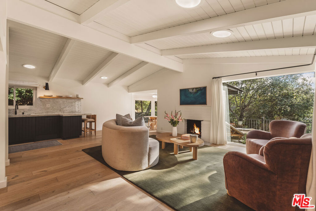 Welcome to a serene, fully furnished 3-bedroom, 3-bathroom home in the heart of Brentwood, Los Angeles available for a 6+ month lease. Designed for both comfort and elegance, this private residence offers spacious living in one of LA's most sought-after neighborhoods. The home features a private upstairs master suite with a luxurious en suite bathroom, along with two additional bedrooms on the main floor. A centrally located home office offers the ideal space for remote work or quiet focus. The open-concept kitchen, dining, and living area is perfect for both everyday living and entertaining, and flows seamlessly into a light-filled sunroom or breakfast area.Step outside to a large, beautifully maintained outdoor deck ideal for hosting gatherings, enjoying meals al fresco, or simply relaxing in the peaceful surroundings. The landscaped grounds offer lush greenery and exceptional privacy, creating a true sense of retreat.This property also includes a detached two-car garage with a bonus storage room. The home is equipped with a full water filtration system and solar power for clean, energy-efficient living. High-end Miele appliances, including a steam oven, cooktop, and built-in coffee maker, elevate the kitchen experience. Located in a quiet, tree-lined neighborhood, this home offers tranquility while being just minutes from Brentwood's top restaurants, shops, beaches, and more. It's a rare opportunity to lease a fully furnished home in an unbeatable location.Contact us today to schedule a private showing.