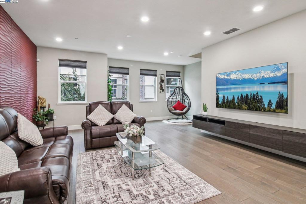 Impeccable EAST facing contemporary townhome style condo located in a highly desirable community with top rated Dublin Schools! This luxuriously updated home boasts 3 Beds/3.5 Baths with a spacious open floor plan and an abundance of natural light. Gourmet kitchen with new stainless steel appliances and  trendy Backsplash, White cabinets, SS appliances, Walk-in Pantry and a large balcony with ample storage! Wood floors, Top-Down-bottom-up Blinds and accent walls w/ Hardwood panels makes it stunning. Spacious owner’s suite, Luxurious bath with dual sinks, an oversized shower and a walk-in closet with Built-in Cabinets. Oversized 2nd bedroom with private bath, 3rd bedroom with ensuite bath. 2 car garage with Epoxy floor, new water softener, Tankless water heater, wired for Electric car charging, & so much more. Easy access to 580/680, 10mins to BART & a minute to the bus stop, close to stores, restaurants and San Francisco Premium Outlet! Walk to 28-acre Fallon Sports Park and to a new highly rated High School! A Must See!