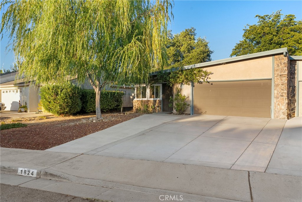 Introducing “Willow Haven” – Situated in the highly sought-after Sierra Bonita Village, a vibrant 55+ community in Paso Robles, this inviting 2-bedroom, 2-bath home offers 1,300 sq. ft. of thoughtfully designed living space, complete with a 2-car attached garage and a private backyard retreat. This home blends natural light, comfort, and functionality, making it perfectly suited for everyday living and entertaining.
Step inside to a bright living room with hardwood flooring and expansive front windows that fill the space with natural light. Flowing seamlessly into the dining room, the layout feels open and welcoming. The kitchen features wood cabinetry, tiled floors, a built-in desk, a pantry cabinet, and abundant storage, offering both charm and practicality. Just beyond the kitchen, a versatile bonus space with sliding glass doors provides the perfect spot for a second dining area, entertaining space, or cozy lounge with direct access to the backyard.
The home includes two comfortable bedrooms, each with its own character and storage. The spacious primary suite offers ample closet space, carpeted floors, and a ceiling fan, along with a private en-suite bath complete with tiled finishes, generous cabinetry, and a walk-in shower. The second bedroom is light-filled and sits adjacent to a full bath with additional shelving and cabinetry for easy organization.
Designed with accessibility in mind, the home features extra-wide hallways and a primary bathroom with a walk-in shower, making it wheelchair-friendly and easy to navigate.
Outside, the fenced backyard is bright and airy, filled with greenery and open space. A covered backyard entrance offers an ideal spot for sitting or quiet relaxation, while multiple storage sheds provide practical space for tools, gardening, or hobbies.
Just minutes from downtown Paso Robles, you can spend the day exploring local boutiques, enjoying world-class dining, or savoring award-winning wines at nearby tasting rooms.