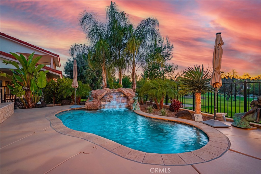 Welcome to this fully remodeled, resort-style Pool/Spa home on the 4th green of the Canyon Lake Golf Course — offering the perfect blend of luxury, comfort, and functionality. This impressive home features 3 spacious master suites, each with private bathrooms, ideal for multigenerational living or hosting in style. A dedicated office, large game or bonus room, and 3.5 bathrooms offer flexibility for any lifestyle.
Step into your backyard retreat with a Pebble Tec saltwater Pool/Spa, two cascading waterfall koi ponds, two view decks — one with a built-in BBQ — and panoramic fairway views. Inside, enjoy two custom wet bars, three wine fridges, a cozy wood-burning fireplace, and refined details throughout.
The downstairs master suite has a private entrance, perfect for guests or in-law quarters. Car enthusiasts and golfers alike will love the oversized 3-car garage, complete with custom cabinets, built in desk, epoxy floors, and a golf cart door. The expansive driveway allows for RV and/or boat parking.
Additional features include:
• Owned solar system
• Propane for cooking, water heater, and pool heater
• Soft water system
• Spacious laundry room with sink and built-in cabinetry
• Fruit trees in the backyard
• Abundant storage throughout.
Located in the gated Canyon Lake community with access to boating, beaches, tennis, golf, and more, this home truly has it all.
Don’t miss your opportunity to own this custom Canyon Lake masterpiece — schedule your private tour today!