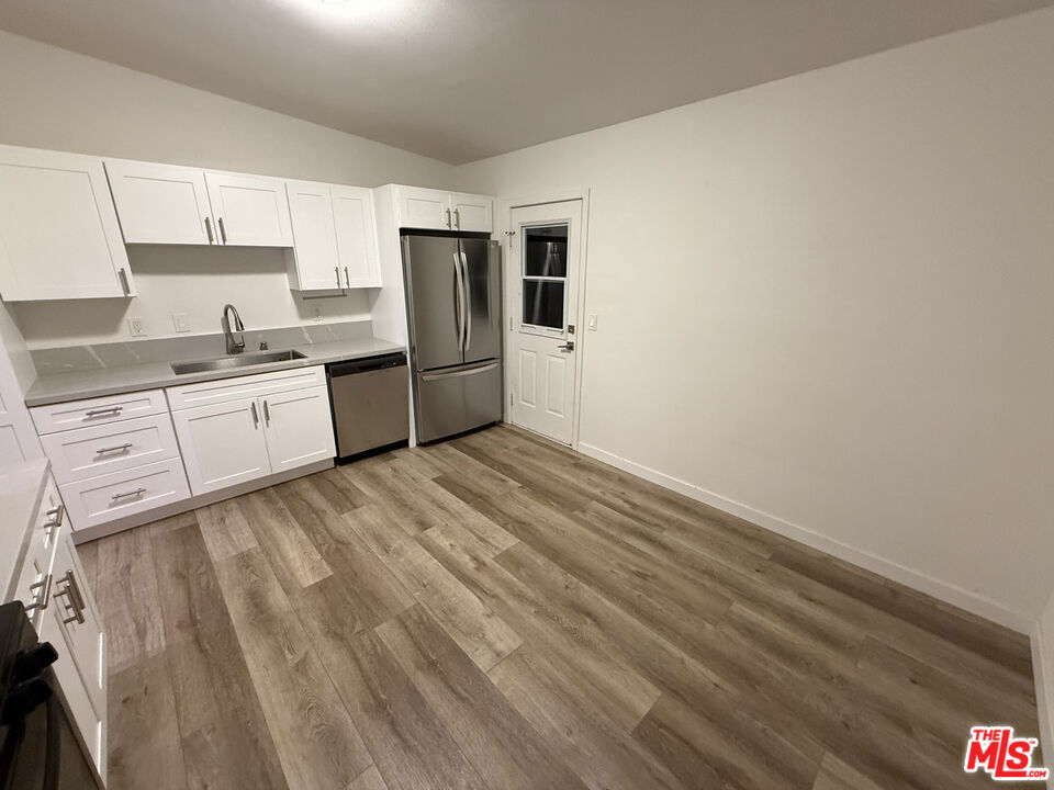 Welcome Home! Live in one Great Rental Income. This Remodeled Homes are located in East Costa Mesa. Home features Laminates, newer Kitchen with Quartz Counter Tops, SS Sink and Appliances. Eat In Kitchen, Stack Washer and Dryer in Unit. Recessed Lights. Featuring a HUGE Backyard with Crush Granite and Foliage.