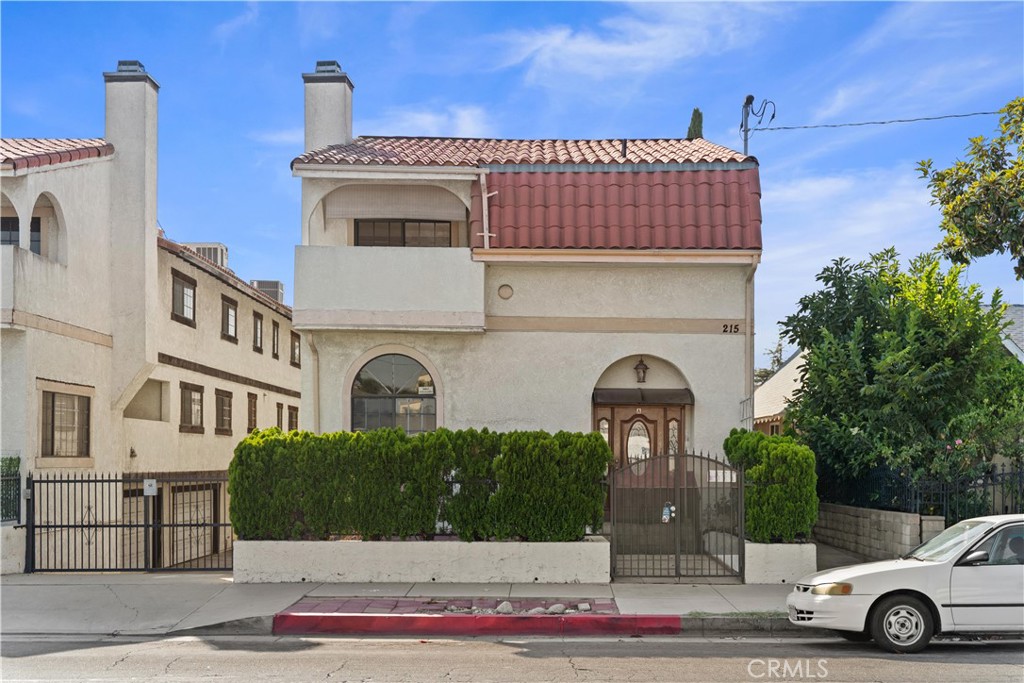 Welcome to 215 N Maple Ave #A — a stunning 3-bedroom, 2.5-bath townhome in an exclusive gated enclave of just six homes in the heart of Montebello. Boasting nearly 1,962 sq ft of living space, this premier Unit A offers the feel of a single-family home and is distinguished by its private, gated front patio — an ideal retreat for relaxing, entertaining, or enjoying your own outdoor oasis.
Inside, the split-level design impresses with soaring ceilings, a sunken living room with fireplace, a formal dining area, and an updated kitchen featuring granite countertops, stainless steel appliances, a walk-in pantry, and a cozy breakfast nook. The finished bonus basement (approx. 400 sq ft, not included in total square footage) provides versatile space for a gym, game room, or home office.
Upstairs, the primary suite delivers dual closets, a private balcony, and a remodeled ensuite bath, complemented by two additional bedrooms and an updated hallway bath. Comfort and energy efficiency are ensured with central A/C and two wall A/C units installed by the current owner. Additional highlights include laminate flooring, an EV charger, and a spacious 2-car garage.
Perfectly situated near Costco, The Shops at Montebello, Grant Rea Park, Montebello Golf Course, and major freeways, this turnkey townhome effortlessly combines privacy, convenience, and modern comfort in one beautifully upgraded package.