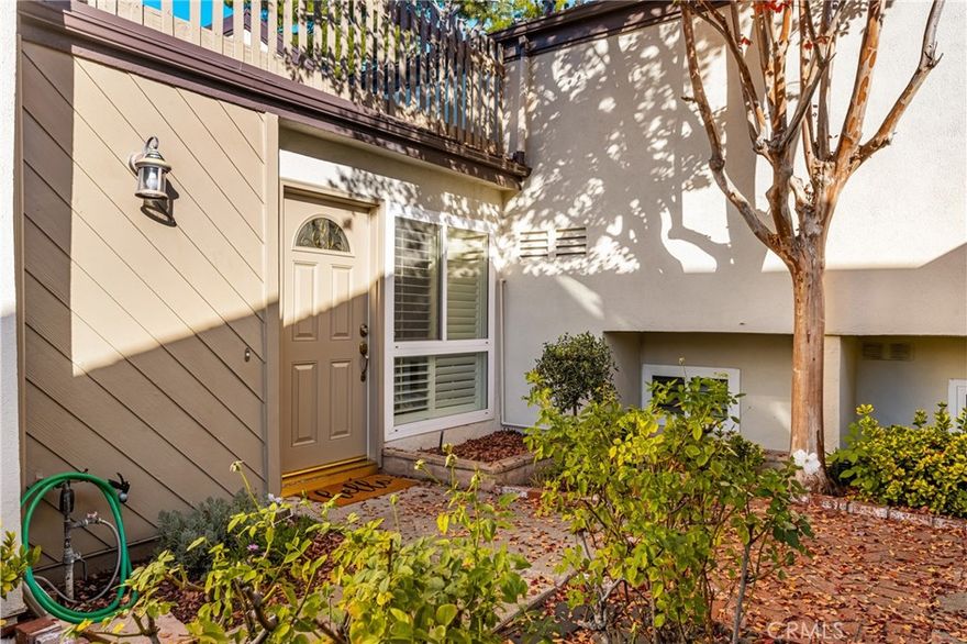 This beautifully upgraded townhome sits alongside scenic Craig Park, just minutes from Cal State Fullerton, Brea Mall, major freeways, and dining. With thoughtful updates, seamless indoor–outdoor flow, and abundant natural light, the home is perfectly suited for everyday living.  Enter through a spacious foyer, that separates the two levels.  The main floor features a spacious living room with rich hardwood floors, a custom fireplace, recessed lighting, and plantation shutters, all open to the central atrium and private patio. The dining area offers an inviting space for gatherings. The remodeled kitchen boasts granite countertops, upgraded hardware, and a breakfast bar that serves the dining room. Just beyond, an enclosed patio offers a peaceful setting for morning coffee or evening unwinding. Upstairs, the primary suite impresses with vaulted ceilings, recessed lighting and  a large sliding door to an oversized balcony. A beautiful updated bathroom offers dual vanities, and walk in shower. A secondary bedroom also features vaulted ceilings, plantation shutters, and a generous closet. A third bedroom overlooks the lush atrium and is ideal as a home office or guest room. The oversized garage with direct-access has extensive built-in storage and is a rare bonus. Located in a small enclave of townhouses with pool and spa. Meticulously maintained and thoughtfully upgraded, this home is truly move-in ready.