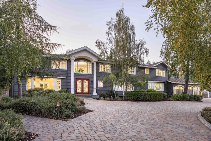 The lush seclusion of Athertons sought-after West of Alameda neighborhood offers a captivating setting for this 7-bedroom home set on 1+ acre. Luxurious details and finishes abound across ~5,500 sf that has been remodeled and expanded to meet the needs of a modern lifestyle, with a welcoming ambiance throughout. Enjoy expansive gathering areas, numerous fireplaces, the chefs kitchen, and the added convenience of a gym and office. Comfortable bedrooms encompass multiple guest suites, while the deluxe primary suite boasts 2 spa-like bathrooms. A true indoor/outdoor lifestyle awaits on the remarkable grounds filled with options for both entertainment and recreation, with a sparkling pool, tennis court, putting green and more. And though you will feel an incredible sense of privacy, you will still be within easy reach of downtown Menlo Park and Palo Alto, two country clubs, Sand Hill Road, Stanford University, and esteemed public and private schools (buyer to verify eligibility).